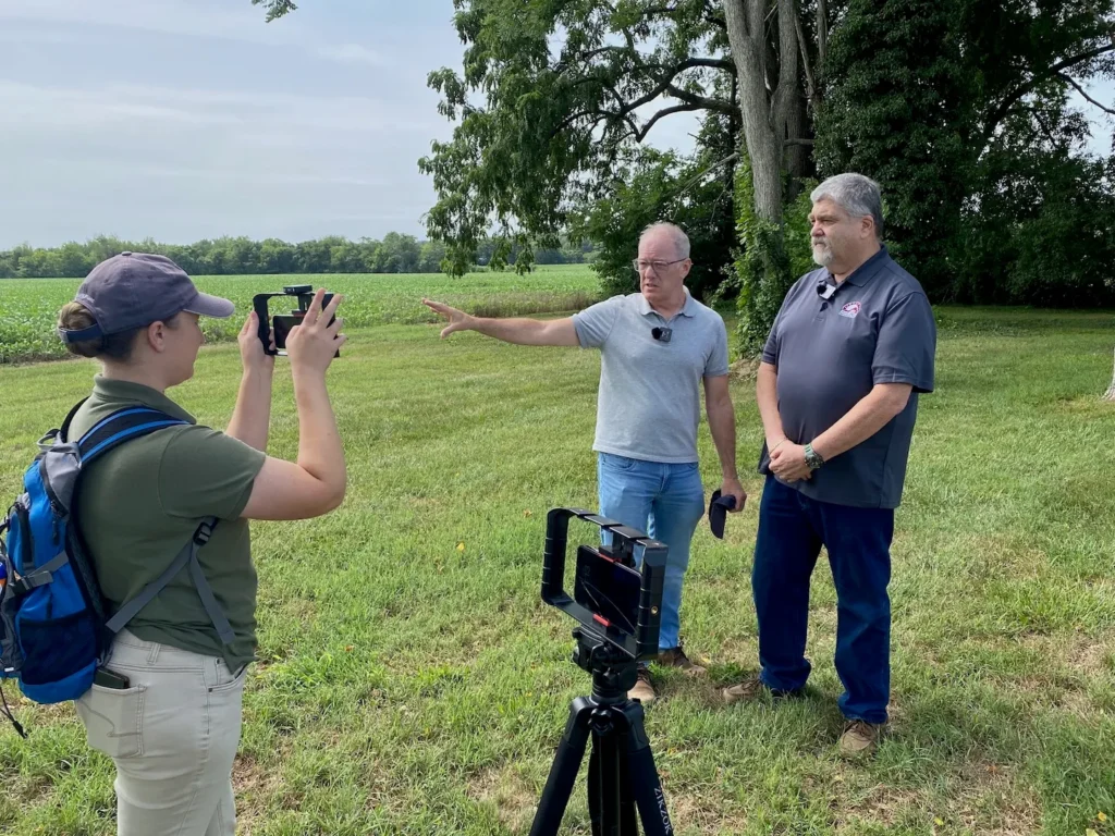 Sarah Kay Bierle of the ABT's Education team catches Tom Gilmore, ABT's Chief Land Preservation Officer, and Tom Van Winkle, president of the 
Central Virginia Battlefields Trust, recounting the history of the Slaughter Pen Farm